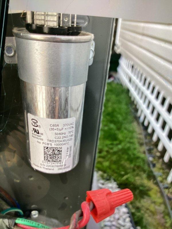 Completed routine cooling maintenance for club member on air handler unit. Inspected dual-run capacitor rated at 370VAC with 35+5 microfarad capacitance, verified proper electrical connections and mounting. Performed electrical testing using digital multimeter to measure voltage and current readings, confirming system operating within normal parameters at 0.67 reading on test equipment.