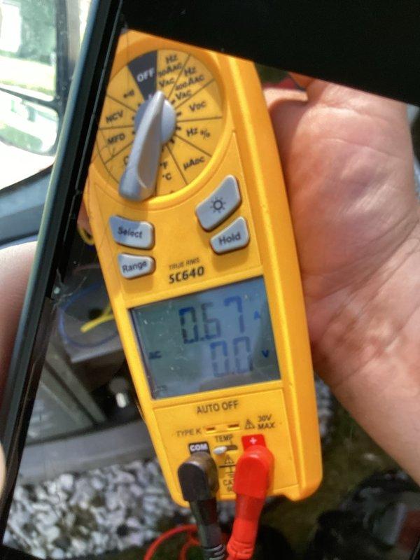 Completed routine cooling maintenance for club member on air handler unit. Inspected dual-run capacitor rated at 370VAC with 35+5 microfarad capacitance, verified proper electrical connections and mounting. Performed electrical testing using digital multimeter to measure voltage and current readings, confirming system operating within normal parameters at 0.67 reading on test equipment.