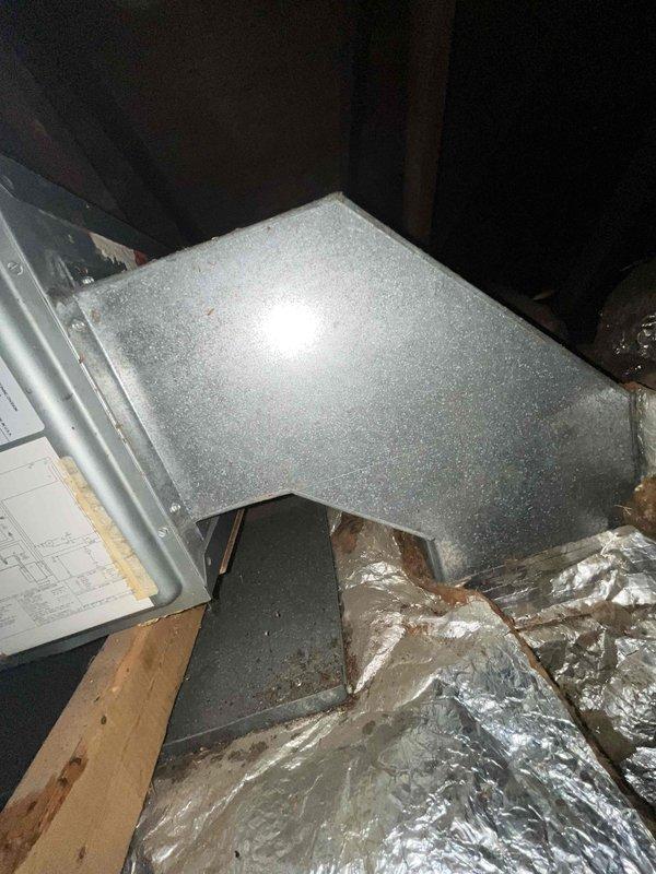Conducted site evaluation of existing HVAC system in attic space for replacement estimate. Customer seeking more energy-efficient air conditioning solution to complement current electric baseboard heating system. Assessed existing ductwork infrastructure, including galvanized sheet metal runs and foil-faced insulation, and documented current air handler installation conditions. Provided recommendations for upgraded cooling equipment options that would integrate with existing duct system while improving overall energy efficiency.