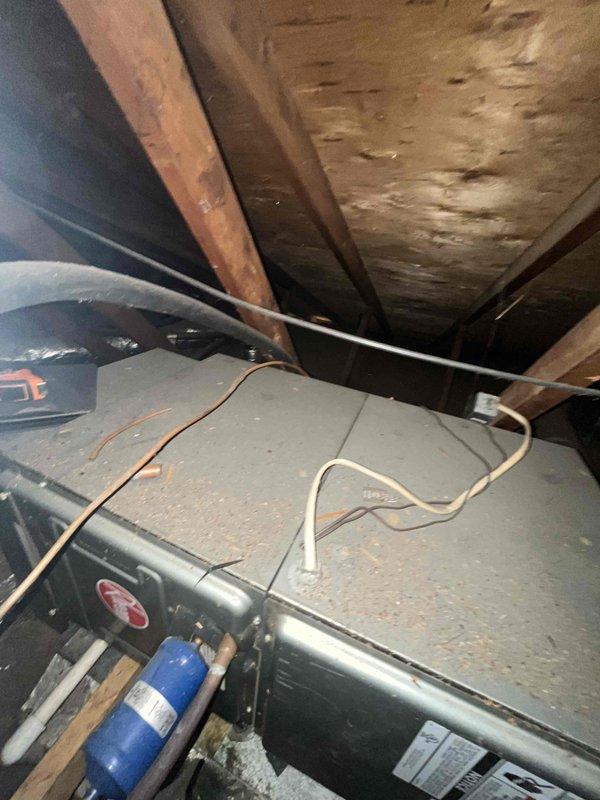 Conducted site evaluation of existing HVAC system in attic space for replacement estimate. Customer seeking more energy-efficient air conditioning solution to complement current electric baseboard heating system. Assessed existing ductwork infrastructure, including galvanized sheet metal runs and foil-faced insulation, and documented current air handler installation conditions. Provided recommendations for upgraded cooling equipment options that would integrate with existing duct system while improving overall energy efficiency.