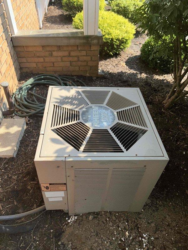 Responded to no cooling complaint on aging residential HVAC system. Upon arrival, performed diagnostic evaluation of outdoor condenser unit and indoor furnace equipment. System showed signs of age-related wear with visible weathering on exterior components. Completed standard troubleshooting procedures to identify root cause of cooling failure, documented equipment condition through photographic evidence, and provided assessment of 10+ year old system's operational status and repair requirements.