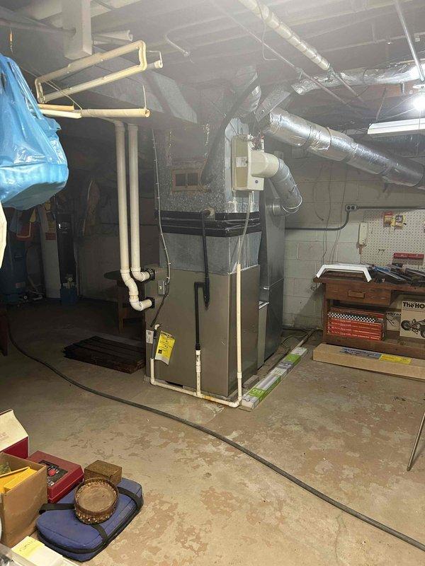 Responded to no cooling complaint on aging residential HVAC system. Upon arrival, performed diagnostic evaluation of outdoor condenser unit and indoor furnace equipment. System showed signs of age-related wear with visible weathering on exterior components. Completed standard troubleshooting procedures to identify root cause of cooling failure, documented equipment condition through photographic evidence, and provided assessment of 10+ year old system's operational status and repair requirements.