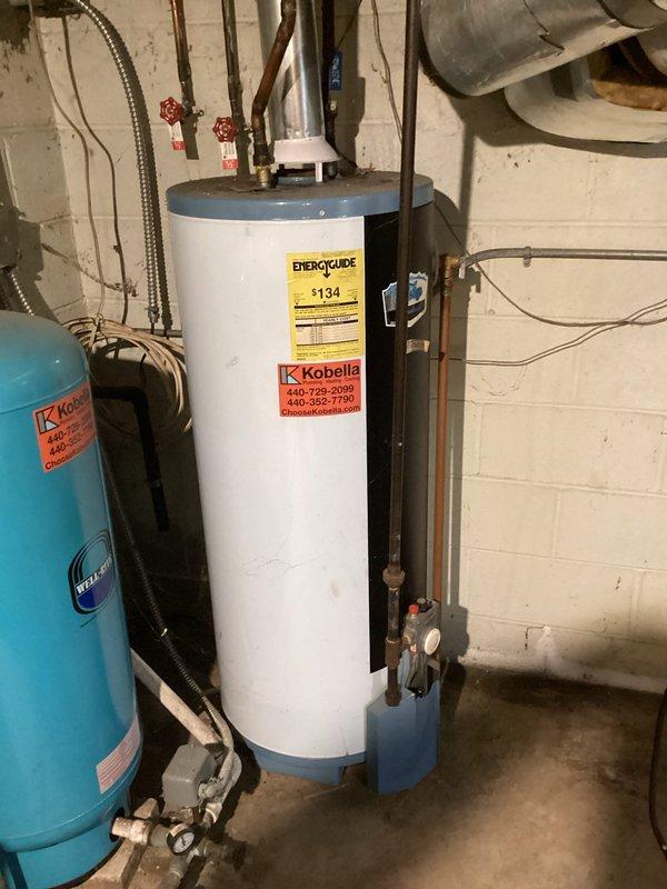 Conducted on-site evaluation for air conditioning replacement options at residential property. Inspected existing HVAC system located in basement mechanical room, including furnace unit with metallic ductwork configuration and associated utility infrastructure. Assessed current equipment condition, ductwork layout, electrical connections, and available space for potential system upgrades. Documented existing installation with photographs showing furnace placement, PVC condensate lines, electrical panel access, and mechanical room configuration. Reviewed water heater and expansion tank positioning to determine clearance requirements for new AC equipment installation. Provided comprehensive replacement options and recommendations based on existing infrastructure and mechanical room layout.