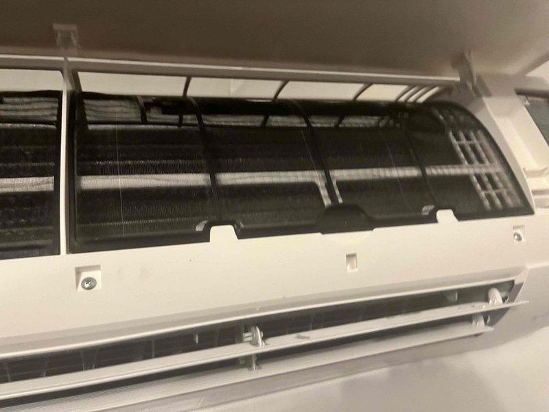 Completed prepaid maintenance visit on wall-mounted air handler following recent installation. Inspected evaporator coil assembly and found heavily clogged air filter with significant dust and debris accumulation. Removed and cleaned filter, verified evaporator coils were in good condition with minimal buildup, and confirmed proper operation of unit.