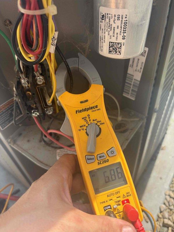 Completed cooling maintenance for club member on air handler system. Performed diagnostic temperature measurements showing supply air at 59.3°F and conducted electrical testing using clamp meter, verifying capacitor function and system amperage at 0.05 reading. Inspected electrical connections, wiring harness, and all internal components with no issues found; system operating within normal parameters.