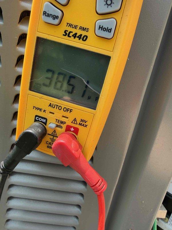 Performed cooling maintenance and diagnosed humidifier issue reported to run constantly even when unplugged. Tested electrical circuits with multimeter showing 38.5V reading and inspected fuse block containing Edison ECNR50 fuses to verify proper power supply and control wiring configuration. Identified wiring concern affecting humidifier operation and documented findings with diagnostic measurements.