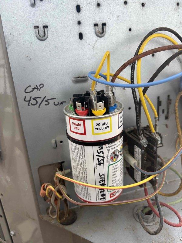 Returned to property to complete installation of previously sold dual-run capacitor and EZ trap. Successfully installed new 45/5 MFD capacitor with proper color-coded wire connections (red for 10 MFD, yellow for 20 MFD) in HVAC control panel. All electrical connections secured to appropriate terminals and unit tested for proper operation. EZ trap installed to condensate drain system to prevent clogs and maintain proper drainage. System inspected and confirmed operational with new components functioning as designed.