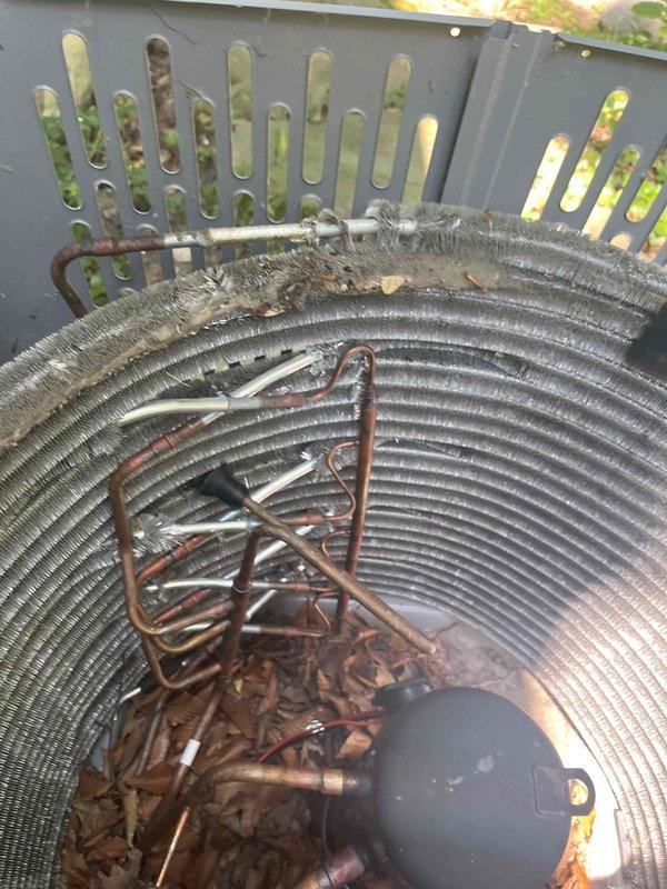 Performed condenser coil cleaning on outdoor air conditioning unit. Upon arrival, found heavy accumulation of dirt, dust, leaves, and organic debris throughout the condenser coil fins and interior components. Copper refrigerant tubing showed significant oxidation and discoloration from environmental exposure. Thoroughly cleaned condenser coil using appropriate methods to remove compacted debris from between fins and restore proper airflow. Removed accumulated organic matter from base of unit and interior surfaces. Discussed ongoing maintenance options with customer to prevent future buildup and maintain system efficiency.