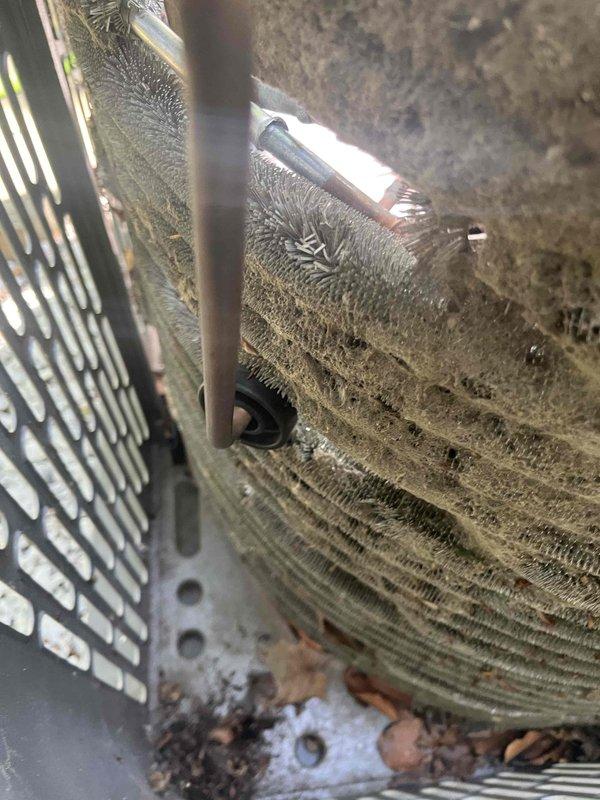 Performed condenser coil cleaning on outdoor air conditioning unit. Upon arrival, found heavy accumulation of dirt, dust, leaves, and organic debris throughout the condenser coil fins and interior components. Copper refrigerant tubing showed significant oxidation and discoloration from environmental exposure. Thoroughly cleaned condenser coil using appropriate methods to remove compacted debris from between fins and restore proper airflow. Removed accumulated organic matter from base of unit and interior surfaces. Discussed ongoing maintenance options with customer to prevent future buildup and maintain system efficiency.