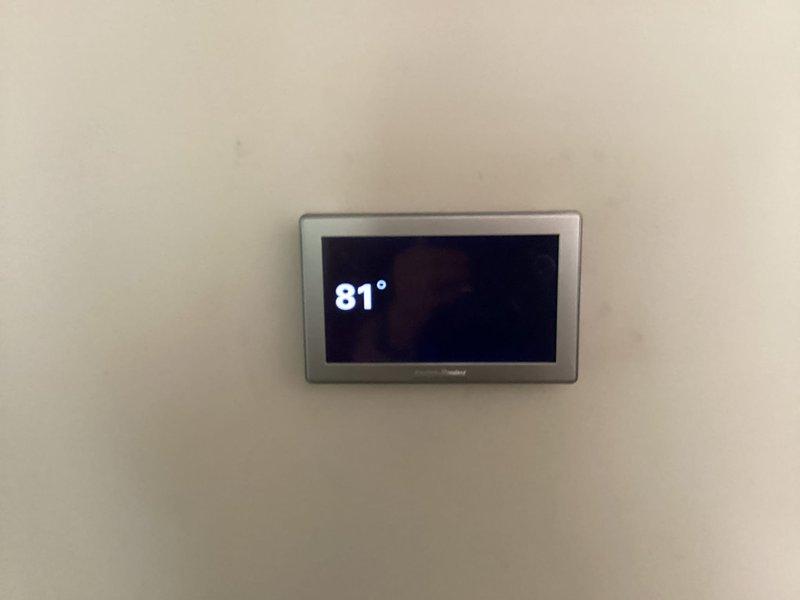 Conducted on-site evaluation for air conditioning system replacement. Assessed existing American Standard thermostat currently reading 81° and inspected HVAC infrastructure including exposed ductwork and refrigerant lines in ceiling space. Provided customer with comprehensive replacement options and equipment recommendations based on current system configuration and installation requirements.