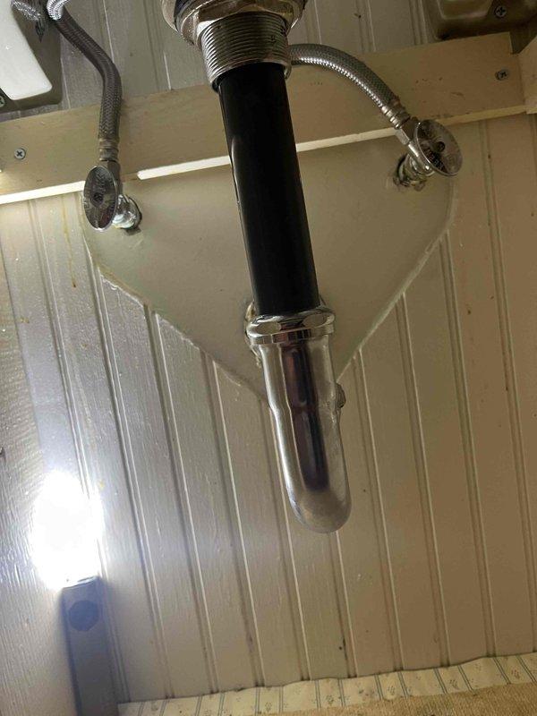 Responded to leaking water valves on washing machine supply lines in utility room. Inspected and serviced shut-off valves on copper supply lines feeding laundry area, addressing active leaks at valve connections. Additionally provided estimate for bathroom faucet replacement based on existing under-sink plumbing configuration observed during service call.