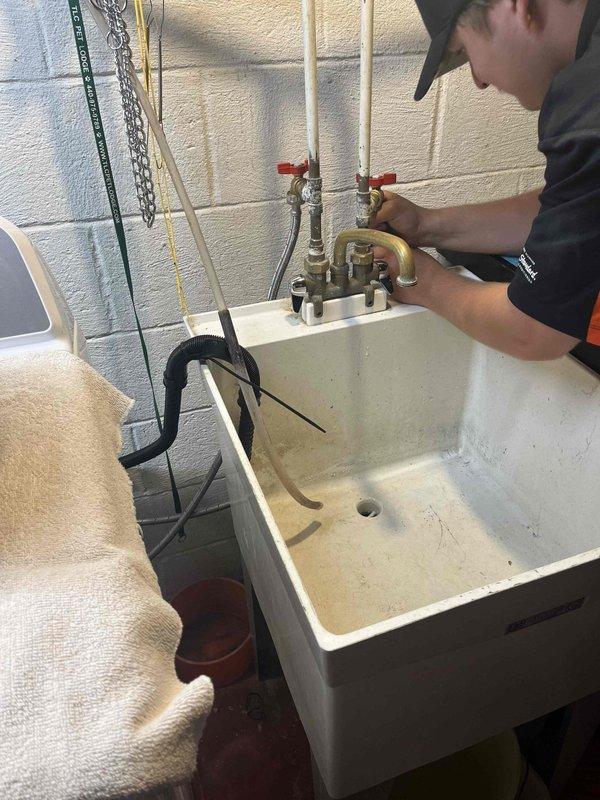 Responded to leaking water valves on washing machine supply lines in utility room. Inspected and serviced shut-off valves on copper supply lines feeding laundry area, addressing active leaks at valve connections. Additionally provided estimate for bathroom faucet replacement based on existing under-sink plumbing configuration observed during service call.