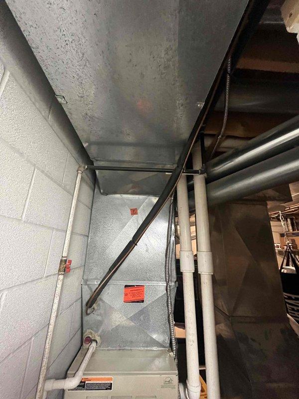 Completed installation of mini-split system in residential property. Customer expressed interest in expanding HVAC project to include furnace and air conditioning system replacement. Documented existing mechanical room conditions, including current ductwork configuration, water heater placement, and available space for future equipment installation to facilitate accurate proposal development for the expanded scope of work.
