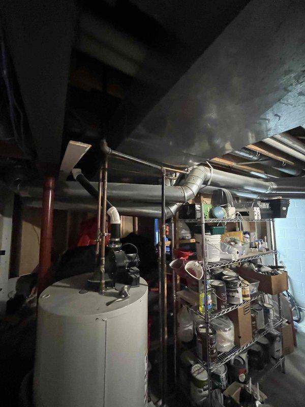 Completed installation of mini-split system in residential property. Customer expressed interest in expanding HVAC project to include furnace and air conditioning system replacement. Documented existing mechanical room conditions, including current ductwork configuration, water heater placement, and available space for future equipment installation to facilitate accurate proposal development for the expanded scope of work.