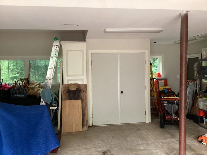 Evaluated existing HVAC system in garage utility area and provided comprehensive air conditioning replacement options. Documented current equipment configuration including existing PVC drainage lines and utility connections to assist in determining proper sizing and installation requirements for new AC system.
