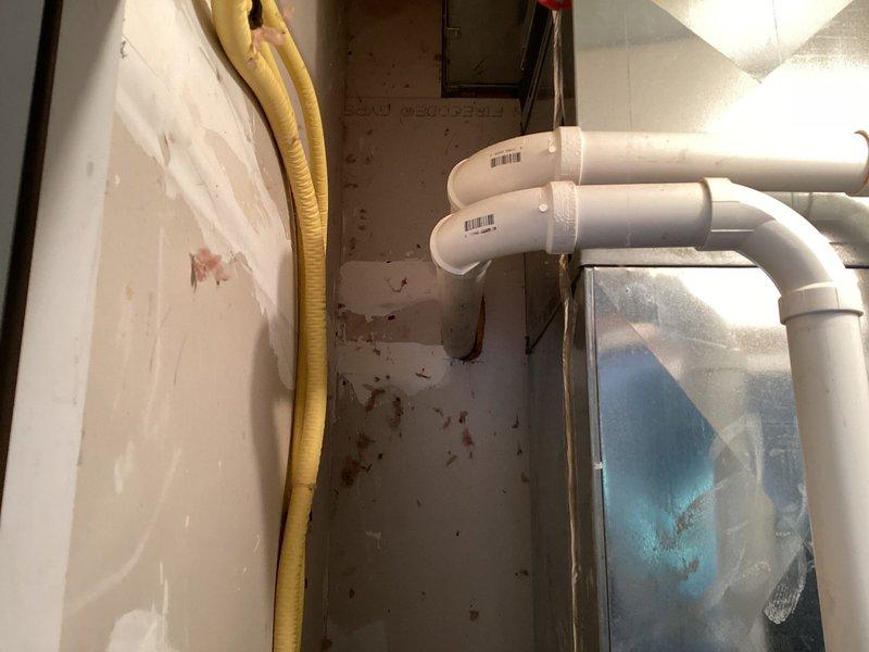 Evaluated existing HVAC system in garage utility area and provided comprehensive air conditioning replacement options. Documented current equipment configuration including existing PVC drainage lines and utility connections to assist in determining proper sizing and installation requirements for new AC system.