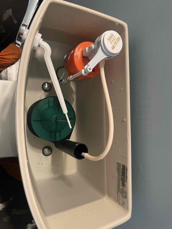 Responded to complaint of multiple toilets intermittently running and filling in 10-year-old residence. Inspected American Standard toilets approximately 1.5 years old to diagnose issue. Removed tank lids and examined internal flush mechanisms, including fill valves, flappers, flush valve assemblies, and float mechanisms. Found standard components functioning within normal parameters with no visible signs of wear, damage, or malfunction. Verified proper water levels and refill tube connections. No evidence of venting issues or active leaks observed during inspection. Photographed tank interiors for documentation purposes.