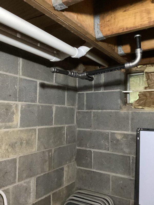 Completed HVAC estimate for conversion from existing oil furnace heating system to natural gas system in basement utility area with gas line already present on property. Assessed current equipment configuration, existing ductwork, venting requirements, and available space for new gas furnace installation. Documented basement infrastructure including exposed ceiling joists, concrete block walls, current plumbing systems, and utility routing to determine optimal equipment placement and installation approach for gas conversion project.