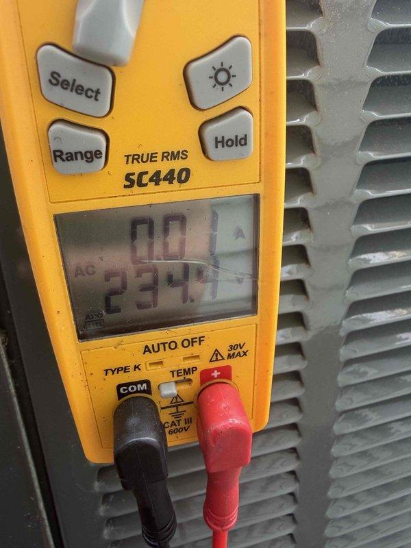 Completed cooling maintenance for club member. Performed system diagnostics and electrical testing using digital multimeter, recording voltage readings of 234.7V AC and 299.9V to verify proper electrical supply and component operation. Inspected condenser unit and documented equipment condition with photos for service records.