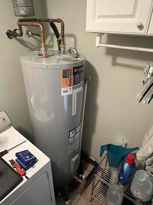 Responded to customer complaint of rotten egg odor in domestic water supply. Inspected water heater and confirmed presence of aluminum anode rod, which had not resolved the sulfur smell issue commonly associated with bacterial reaction in the tank. Evaluated system in conjunction with geothermal heating/cooling setup. Documented existing water heater configuration and plumbing connections for potential water treatment system installation or anode rod replacement to address ongoing odor concerns.