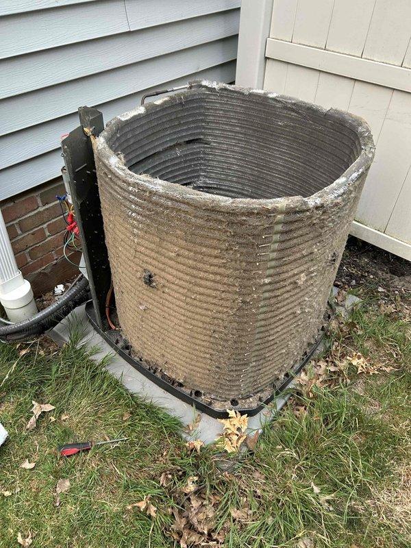 Responded to no cooling complaint on residential AC system installed in 2023. Upon arrival, found outdoor condenser unit running but system not producing cold air despite thermostat calling for cooling. Visual inspection revealed heavily soiled condenser coil with significant accumulation of dirt, debris, and outdoor contaminants restricting airflow through aluminum fins. Unit had not received preventive maintenance since installation. Performed thorough condenser coil cleaning to restore proper heat transfer and airflow. Verified compressor operation and electrical connections at outdoor unit. System returned to normal cooling operation following coil cleaning service.