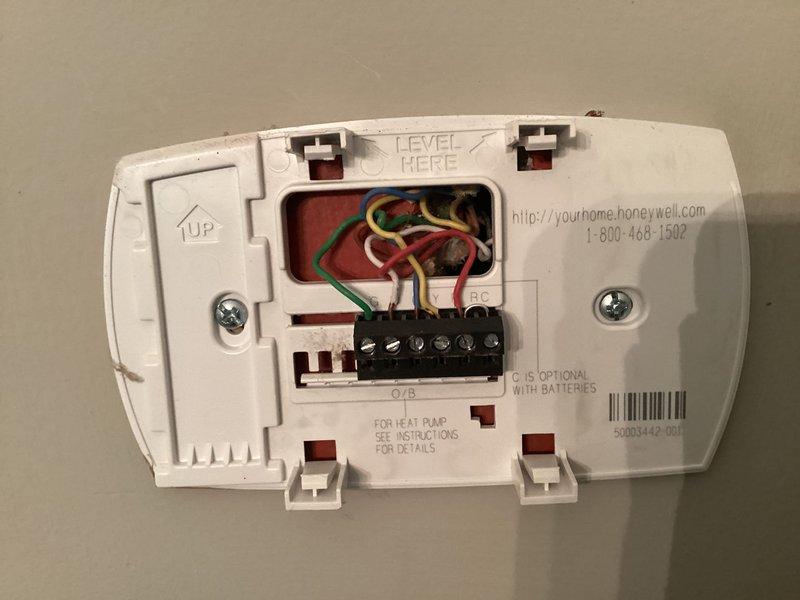 Conducted comprehensive HVAC system evaluation for equipment replacement estimate. Documented existing Honeywell thermostat wiring configuration with standard color-coded connections (R, Y, G, W, C terminals) and assessed current heating unit in mechanical space. Provided detailed replacement recommendations and equipment specifications based on system assessment.
