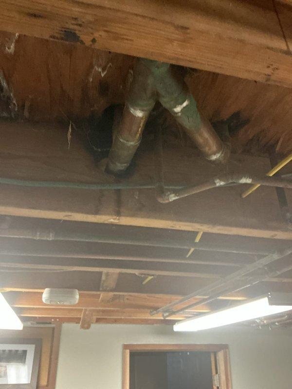 Responded to basement water leak emergency involving copper supply lines. Upon inspection, identified active leaks at pipe penetrations through floor joists in unfinished basement ceiling area. Secured leaking sections, assessed pipe condition showing age-related corrosion and wear, and recommended permanent repairs to prevent water damage. Documented existing plumbing configuration and structural penetrations for follow-up work.