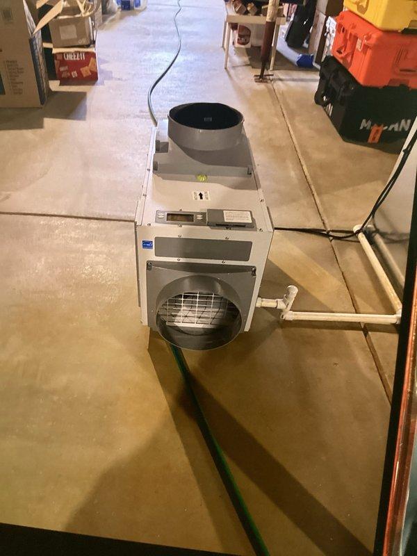 Completed installation of whole-home dehumidification system as previously sold and approved. Installed basement-mounted dehumidifier unit with proper drainage connections via PVC piping and established electrical service. Connected unit to existing HVAC ductwork in attic space using appropriate ducting and verified proper integration with air handling system. System tested and operational upon completion.