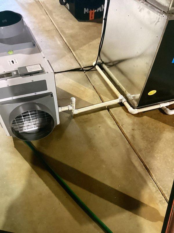 Completed installation of whole-home dehumidification system as previously sold and approved. Installed basement-mounted dehumidifier unit with proper drainage connections via PVC piping and established electrical service. Connected unit to existing HVAC ductwork in attic space using appropriate ducting and verified proper integration with air handling system. System tested and operational upon completion.