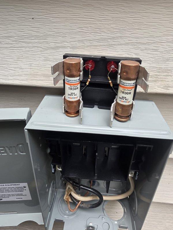 Completed full HVAC system installation with new outdoor condensing unit and electrical service connections. Installed 300-amp fused disconnect box with TR30R fuses and proper copper wiring terminations to exterior wall, ensuring all electrical connections meet code requirements and system specifications. All components tested, leveled, and verified operational upon completion.