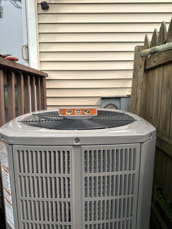 Completed full HVAC system installation consisting of American Standard 2-ton heat pump outdoor unit, matching air handler, and 15 KW emergency heat strip. Outdoor condenser was leveled and properly positioned on pad with clearances verified per manufacturer specifications. Air handler and heat strip were installed with electrical disconnect and time-delay fuses properly sized and secured, ensuring all electrical connections met code requirements and system operates safely and efficiently.