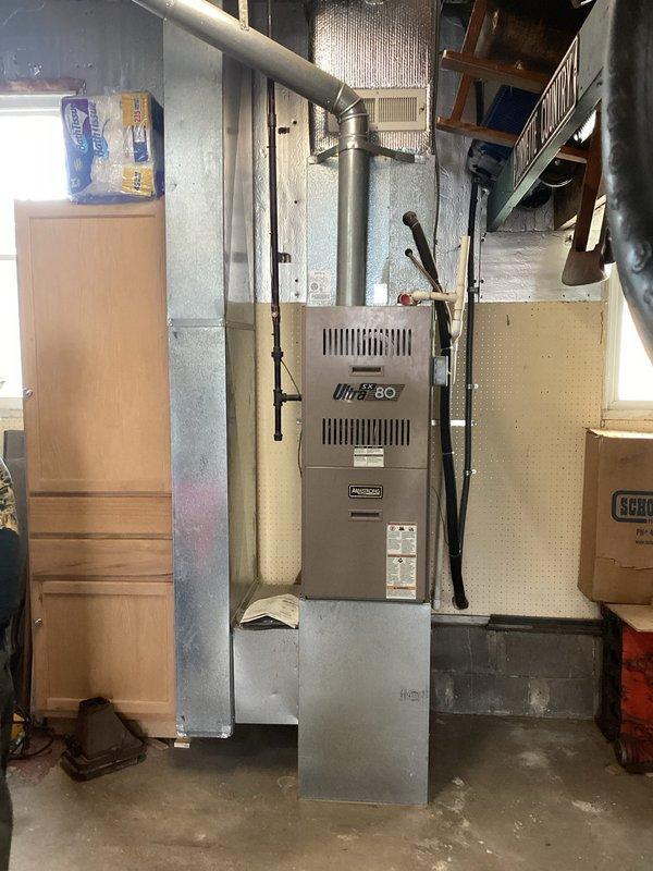 Conducted on-site evaluation of 27-year-old heating system for whole-home replacement estimate. Assessed existing furnace installation in basement and outdoor air conditioning condenser unit to determine specifications and requirements for new equipment replacement, documenting current system configuration and installation conditions for comprehensive replacement proposal.