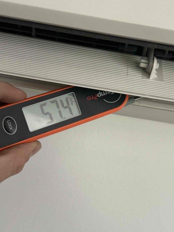 Returned to property to complete installation of new EEV coil that was previously sold. Upon arrival, verified system operation and measured supply air temperature at register, confirming 54.8°F output. Installed temporary portable air conditioning unit in sunroom to maintain comfort during system downtime. Successfully completed EEV coil replacement and restored central HVAC system to normal operation.