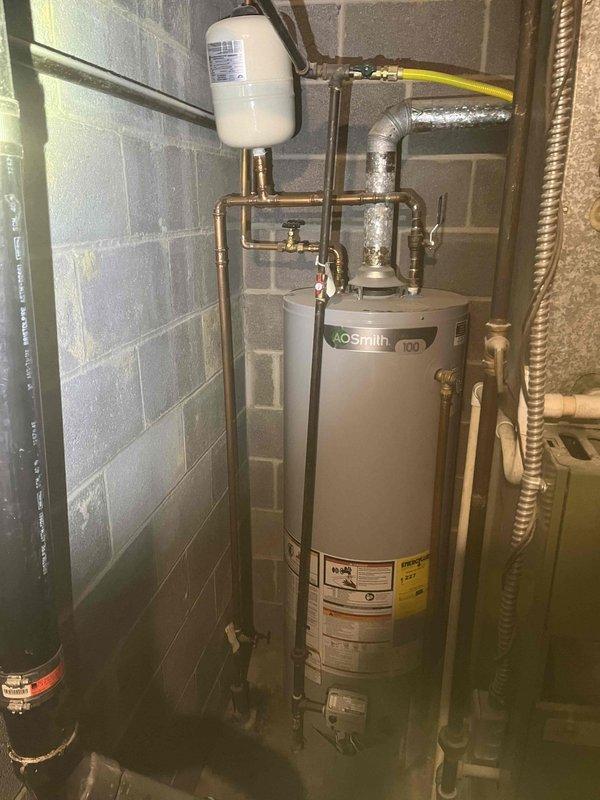 Responded to service call for leaking faucet in basement utility area of 40-year-old residential property. Upon inspection, assessed plumbing infrastructure including water heater connections, copper piping network, and associated fixtures in mechanical room with cinder block construction. Repaired basement faucet to eliminate leak, ensuring proper function and water flow control. Verified all connections were secure and tested system operation to confirm no additional leaks were present in the immediate plumbing area.