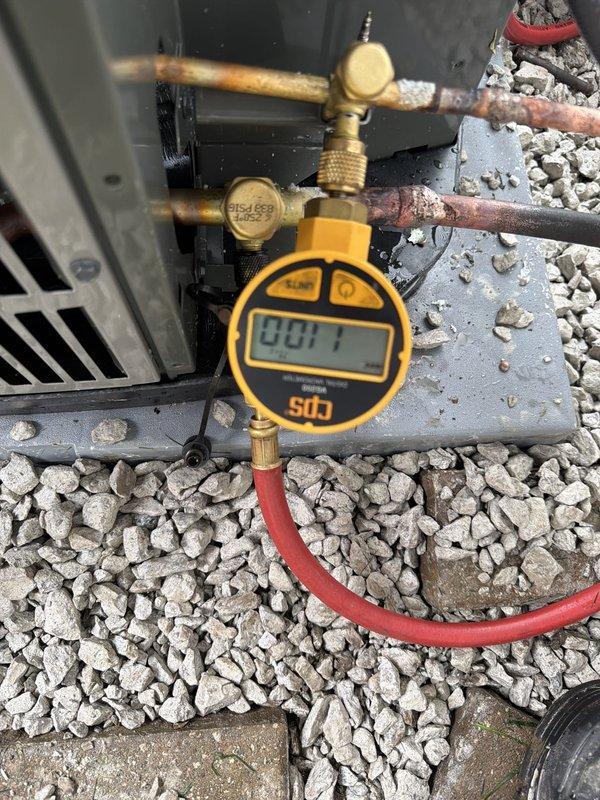 Completed full HVAC system installation including outdoor condensing unit with proper electrical disconnect and refrigerant line connections. System was pressure tested and charged to manufacturer specifications, with all readings verified within normal operating parameters. Unit was mounted on gravel pad with appropriate clearances and all electrical conduit properly secured to building exterior per code requirements.
