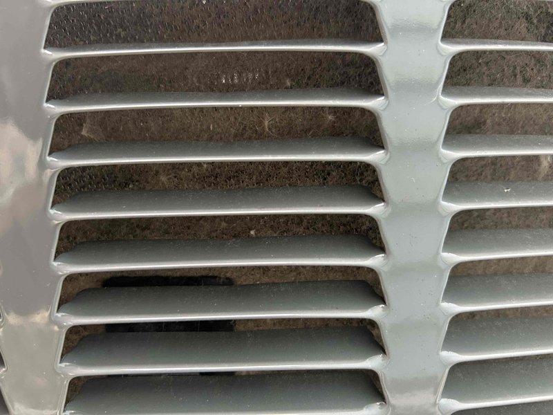 Completed final prepaid maintenance visit for air handler system. Performed standard inspection and documentation of HVAC equipment, including examination of ventilation grilles which showed accumulated dust and debris requiring attention. Photographed equipment condition for service records and verified system operational status per maintenance agreement terms.