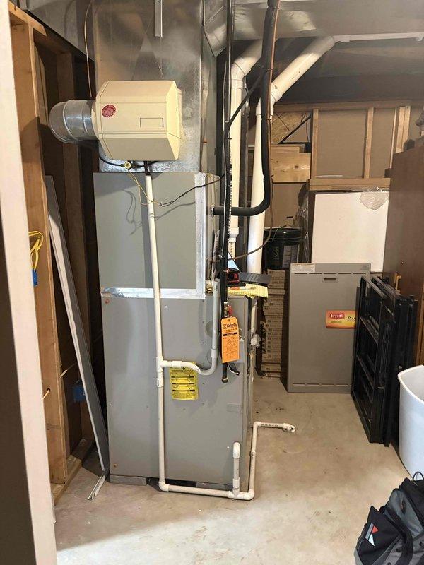 Responded to service call for AC blower motor failure with error code 41 displayed on 20-year-old furnace paired with 10-year-old outdoor condensing unit. Performed diagnostic evaluation of HVAC system, confirmed blower motor inoperative and noted motor does not utilize a capacitor. Documented existing equipment configuration including furnace in basement location, Nest thermostat wiring connections, and overall system condition. Provided comprehensive estimate for complete HVAC system replacement due to age of existing equipment and cost-effectiveness of full system upgrade versus component repair.