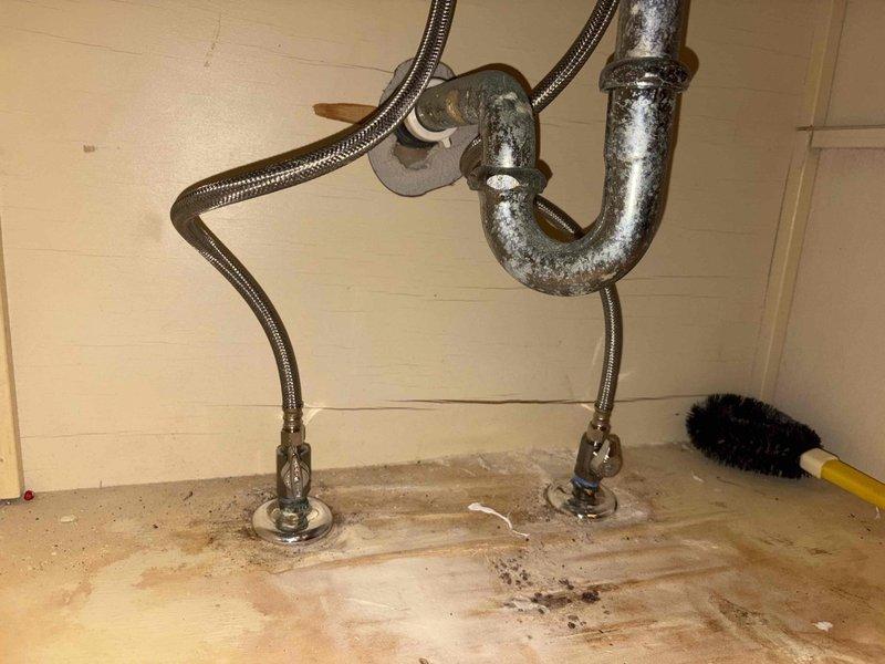 # Comprehensive Plumbing System Overhaul and Component Replacement

Completed extensive plumbing system renovation addressing multiple critical components and water quality equipment. Replaced aging pressure tank with new FL 12 model and installed new T assembly for improved water distribution. Relocated 1-inch feed line to copper piping toward wall for better system configuration and accessibility.

Removed existing iron filter and water softener units from system. Disassembled and cleaned piston stack assembly, performing thorough inspection of internal components to assess condition and functionality. Installed 11 emergency shut-off valves throughout the plumbing system at strategic locations to provide isolation capability for future maintenance and emergency situations.

Replaced kitchen faucet with new fixture, ensuring proper mounting and connection to supply lines. Secured and repositioned high-mount dishwasher installation, rerouting discharge line to connect directly into gar