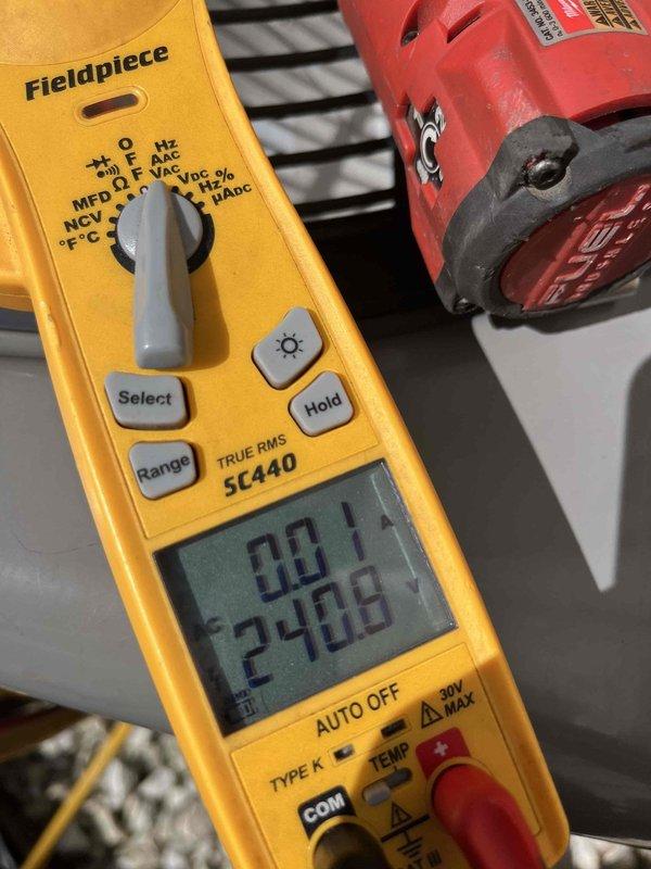 Performed comprehensive air conditioning tune-up and system evaluation. Conducted temperature diagnostics using digital thermometer, recording supply air temperature of 54.8°F, and verified electrical parameters with multimeter showing proper voltage readings of 240V. System operating within normal specifications with all components functioning correctly.