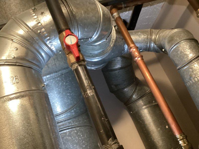 Conducted HVAC system evaluation for cooling inadequacy complaint where indoor temperatures reached 78 degrees during peak heat conditions. Inspected thermostat wiring and terminal connections, documented existing ductwork configuration including galvanized metal supply and return ducts with zone damper assembly, and assessed copper refrigerant line connections with service valve. Provided comprehensive replacement estimate based on system performance deficiencies and equipment age considerations for residential comfort improvement.