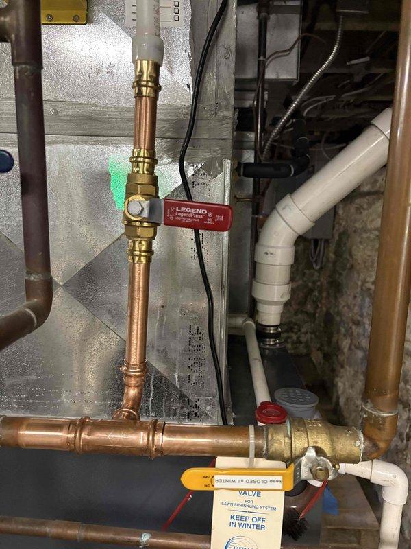 Completed return visit to install water heater expansion tank at standard height specification as originally sold. Verified proper copper pipe connections, ball valve installation with Legend valve assembly, and appropriate mounting height per standard requirements rather than universal height configuration. All plumbing connections secured with brass compression fittings and system tested for proper operation.
