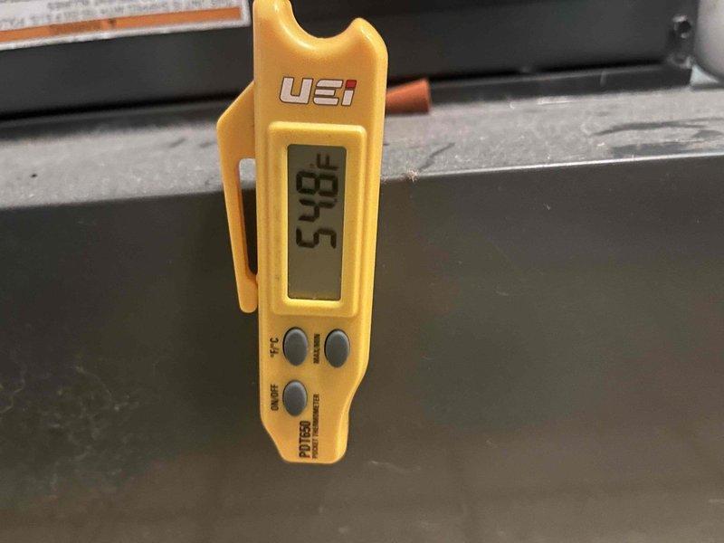 Returned to complete leak search on HVAC system after customer reported diminished cooling performance and suspected refrigerant loss. Utilized digital manifold gauges to measure system pressures and temperatures, recording superheat at 76°F and subcooling at 6.5°F, with operating pressures of 120.7 psig on low side and 262.7 psig on high side. Performed comprehensive leak detection procedures using previously injected UV dye and clamp meter diagnostics to identify potential leak location that was flagged during previous visit.