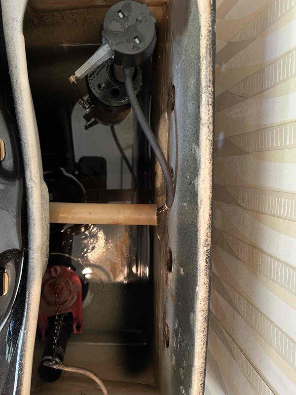 Responded to service call for toilet backing up. Upon inspection, discovered issue was related to HVAC condensate drain system rather than plumbing drain line. Found condensate drain pan severely clogged with sediment, biological growth, and debris causing water backup. Cleared accumulated sludge from drain pan, cleaned float switch assembly, and verified proper drainage function. System tested and operating correctly upon completion.