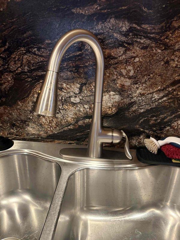Returned to complete kitchen plumbing installation previously sold, including basket strainer replacement, drain tubular assembly, and hose bib installation. Successfully installed new kitchen sink basket strainer with proper sealing, replaced P-trap and drain tubular components under sink with white PVC piping, and ensured all connections were secure and leak-free. All plumbing fixtures tested and verified operational upon completion.