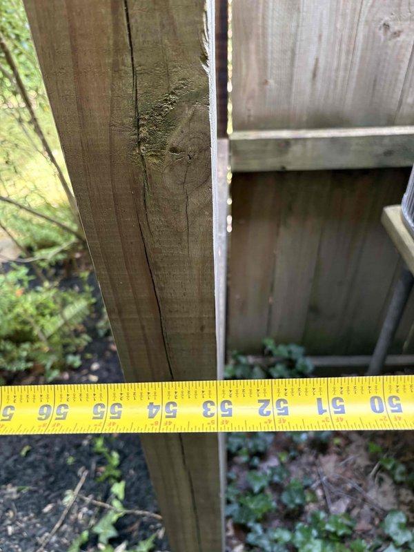 Conducted on-site evaluation for complete HVAC system replacement in all-electric residential property. Assessed existing 23-year-old heat pump condensing unit located exterior against privacy fence and 23-year-old air handler installed in basement. Unit showed weathering and discoloration on exterior casing, with compressor previously replaced in 2014. Documented current equipment condition through photographic survey, including refrigerant line routing and installation clearances. Provided comprehensive replacement estimate for new heat pump and air handler system to modernize climate control equipment.