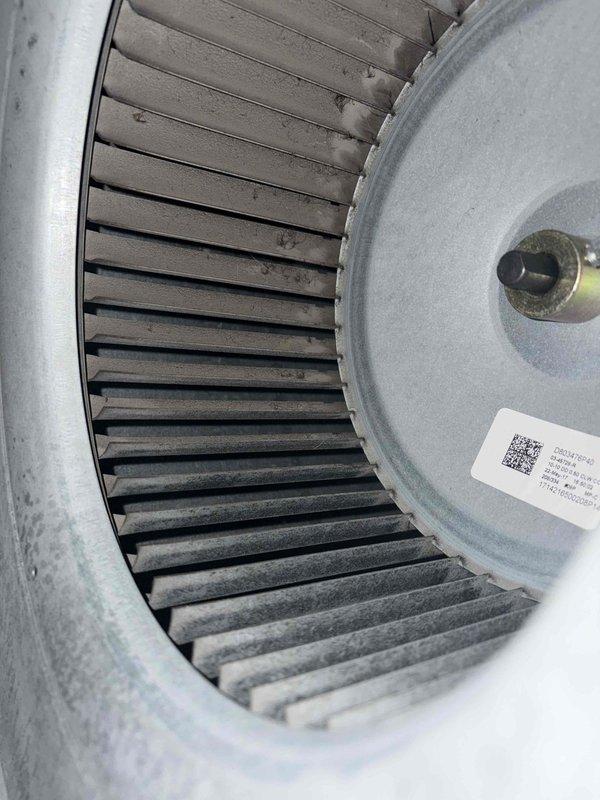 Completed cooling maintenance for club member. Performed electrical diagnostics using digital multimeter, recording amperage readings of 24.43 amps at the outdoor unit and inspecting capacitor connections. Inspected indoor blower wheel assembly, noting dust accumulation on fan blades typical of normal operation.
