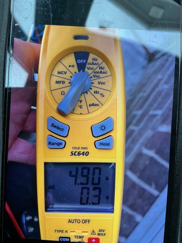Completed cooling maintenance per club membership plan. Performed electrical diagnostics using digital multimeter to verify system amperage and capacitance readings on HVAC unit, with measurements indicating 490 microfarads and 0.3 amps. Discussed dual-zone system configuration and requirements with property owner as requested.