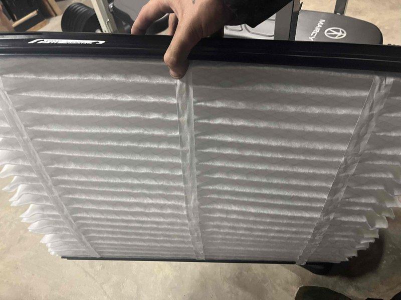 Responded to cooling complaint where system was running but struggling to reach desired temperature setpoint. Upon inspection, found heavily soiled air filter restricting airflow to the system. Replaced dirty filter with new pleated filter to restore proper airflow. Verified Trane outdoor unit operation and confirmed system is now cooling effectively to setpoint.