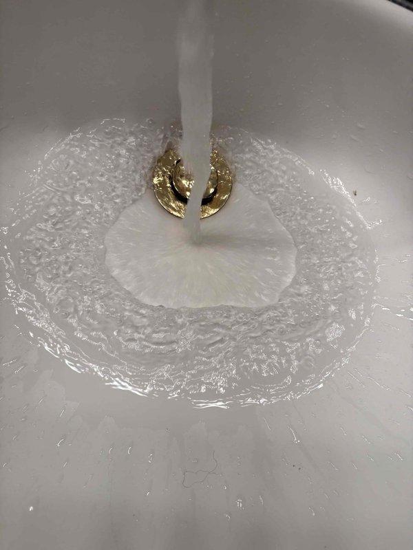 Completed return visit to finalize plumbing repair work that was previously sold, with fixtures still pending delivery. Performed thorough cleaning of work area, removing accumulated dust, lint, and debris from service location usingdustpan and brush on industrial flooring surface. Tested water flow and drainage at sink fixture to verify proper operation, with clear water running smoothly through drain system. Total time invested was six hours with additional technician assistance requested for project completion.