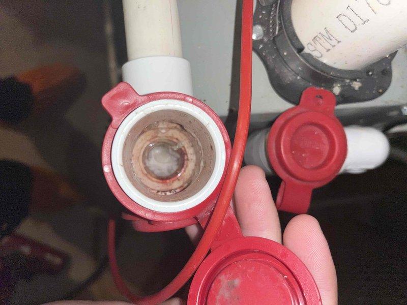 Completed prepaid cooling maintenance club visit. Performed system diagnostics using digital manometer, recording pressure readings of +0.706 to verify proper refrigerant charge and airflow. Inspected water heater drain valve, noting mineral buildup and sediment accumulation inside valve assembly that may require future service attention.